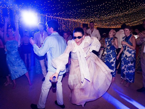 High-energy dance moment at Petra Farm Paros wedding party.