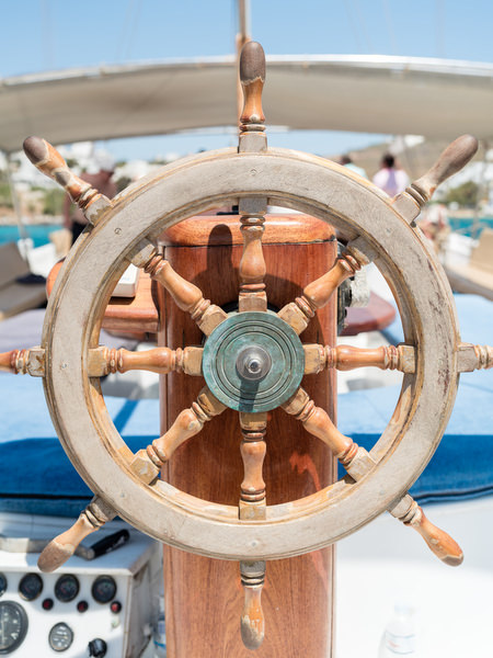 Close-up of sailboat steering wheel during Paros wedding boat trip