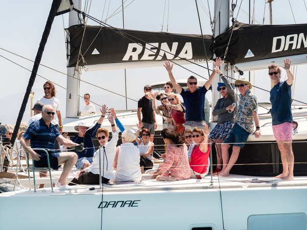 Guests dancing on catamaran during Greek island wedding boat party