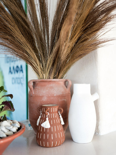Raffia decor and menu styling for Greek island pre-wedding celebration