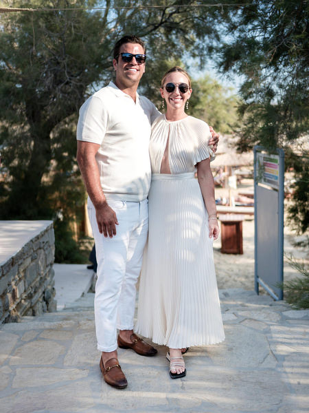 Wedding guests posing together at beachside celebration