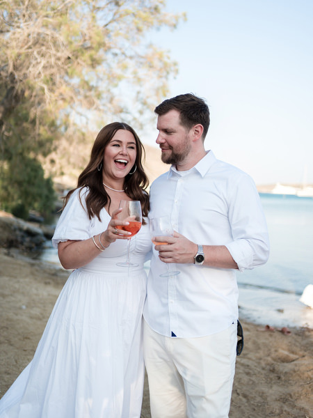 Guests enjoying drinks during Greek island pre-wedding party