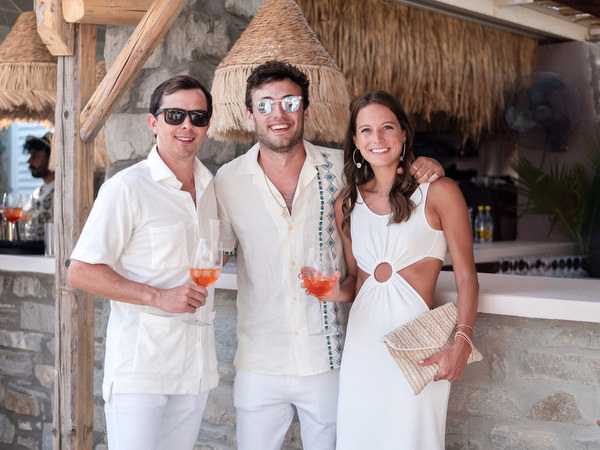 Friends posing together during Paros wedding weekend celebration