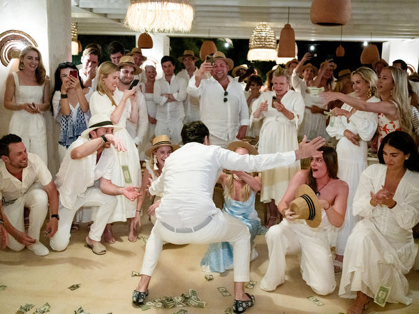 Bride and groom dancing with guests at Monastiri Beach