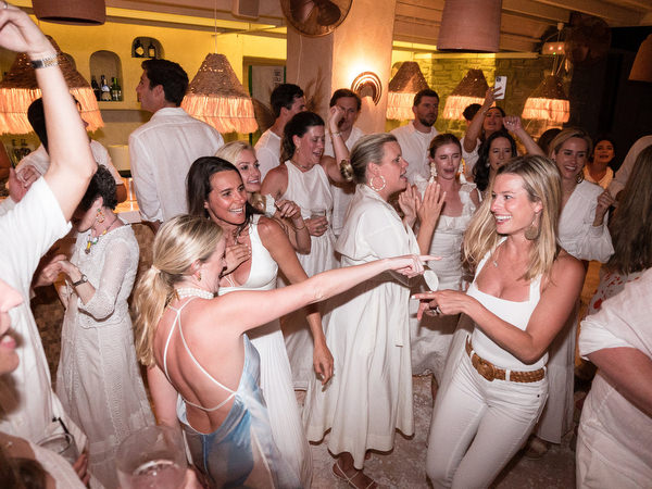 Guests cheering during Paros wedding welcome celebration