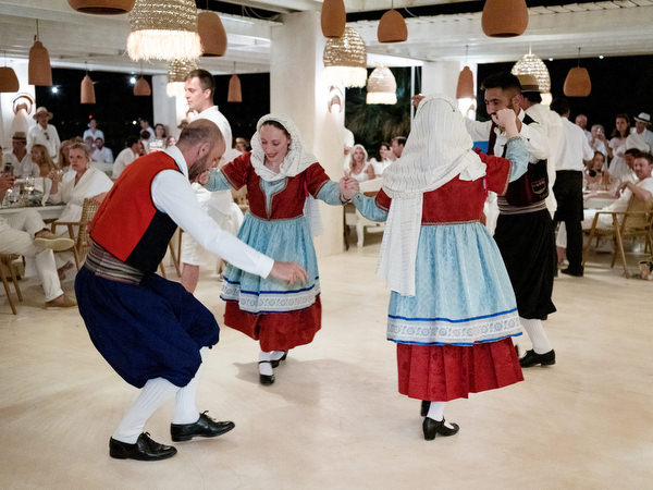 Greek dancers performing traditional dance at wedding celebration