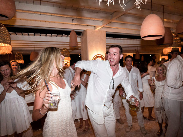 Wedding guests celebrating late night at Monastiri Beach
