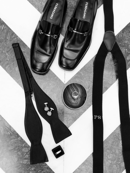 Black and white groom accessories including tuxedo shoes, bow tie, and cufflinks for Athens Catholic wedding.