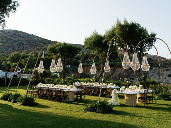 Outdoor wedding reception design with crystal chandeliers at Island Resort Athens Riviera.