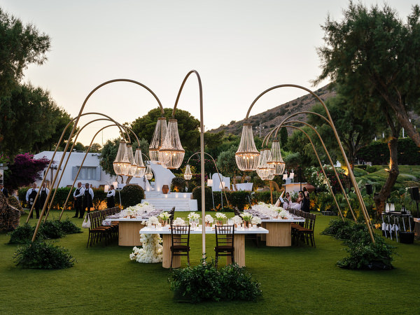 Luxury wedding reception layout at The Residence Island Resort overlooking Athens Riviera at sunset.