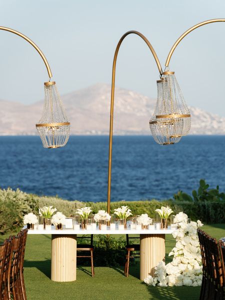 Hanging crystal chandeliers over outdoor wedding reception at Island Resort Athens Riviera.