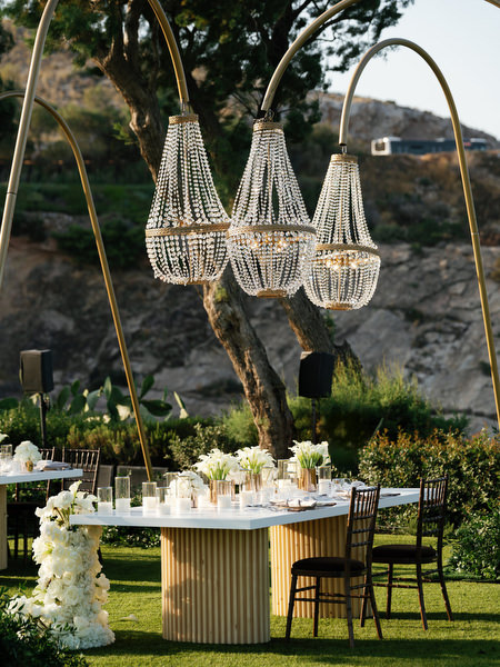 Outdoor wedding reception design with crystal chandeliers at Island Resort Athens Riviera.