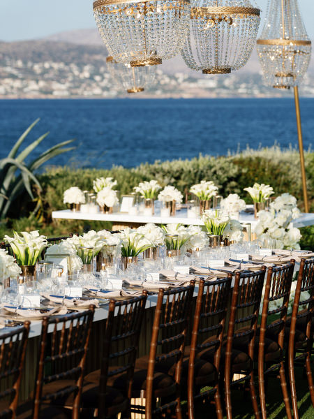 Outdoor wedding reception design with crystal chandeliers at Island Resort Athens Riviera.