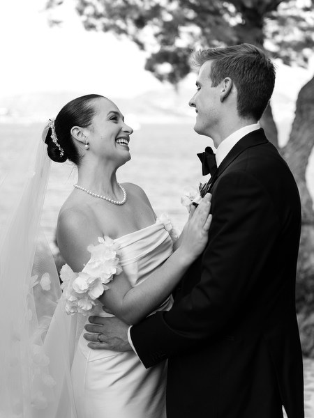 Black and white portrait of bride and groom laughing at Island Resort Athens Riviera.