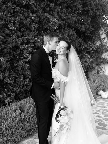 Black and white portrait of bride and groom embracing at Island Resort Athens Riviera.