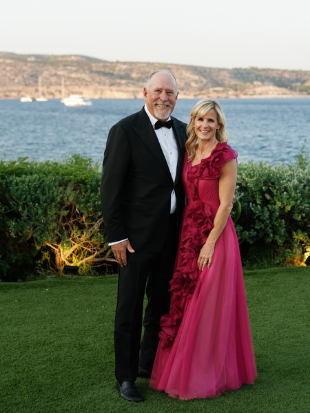 Parents of the couple posing at The Residence Island Resort Athens Riviera during golden hour.