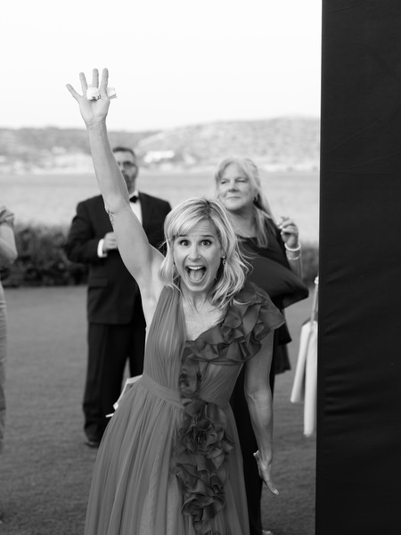 Guest raising hands in excitement during luxury Athens Riviera wedding reception.