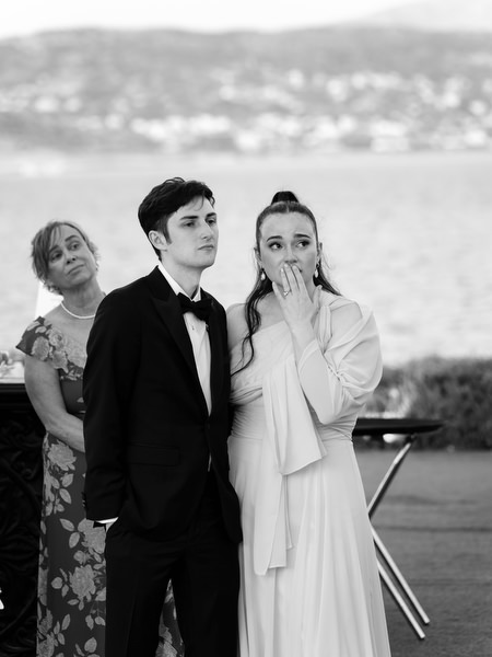 Wedding guests reacting emotionally during speeches at The Residence Island Resort Athens Riviera.