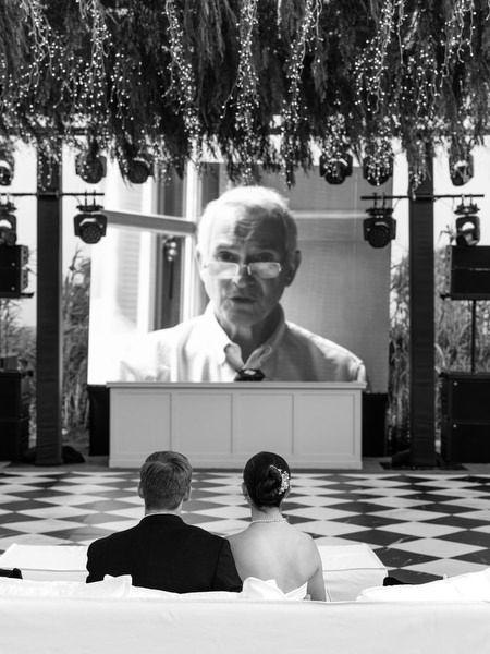 Emotional video tribute displayed during wedding reception at Island Resort Athens Riviera.