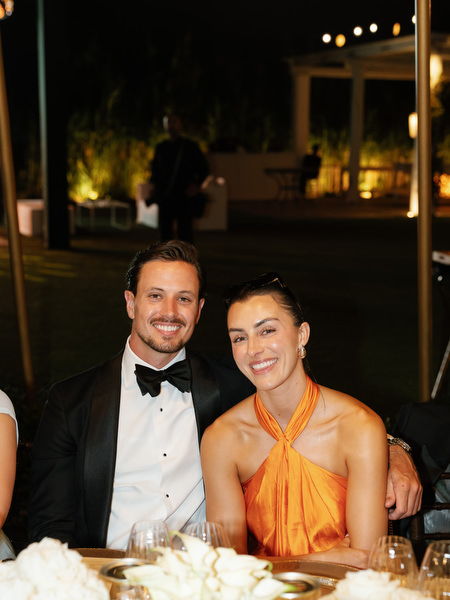 Wedding guest portrait during candlelit reception at The Residence Island Resort Athens Riviera.