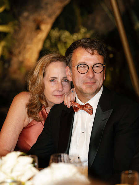 Couple seated during elegant evening reception at Island Resort Athens Riviera wedding.