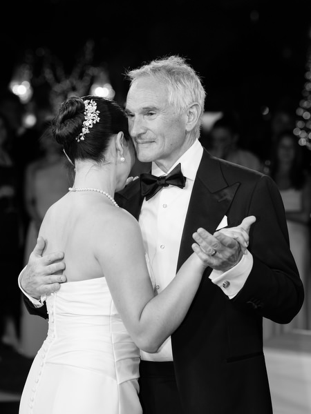 Bride dancing with father during emotional reception moment at Island Resort Athens Riviera.