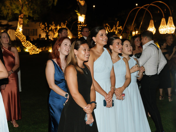 Bridesmaids reacting emotionally during first dance at The Residence Island Resort Athens Riviera.