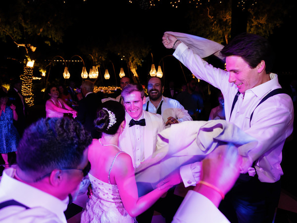 Bride and groom dancing together during late-night party at The Residence Island Resort Athens Riviera.