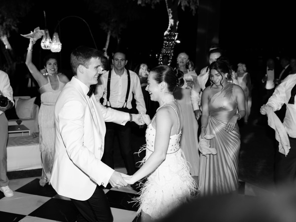 Bride and groom dancing together during late-night party at The Residence Island Resort Athens Riviera.