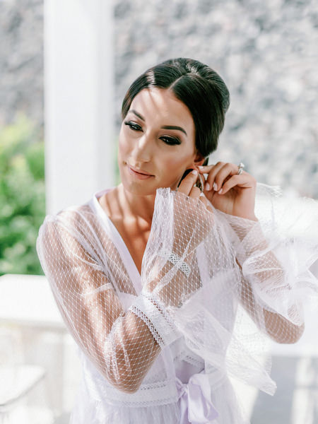 Bride getting ready at Eros Santorini overlooking the caldera.