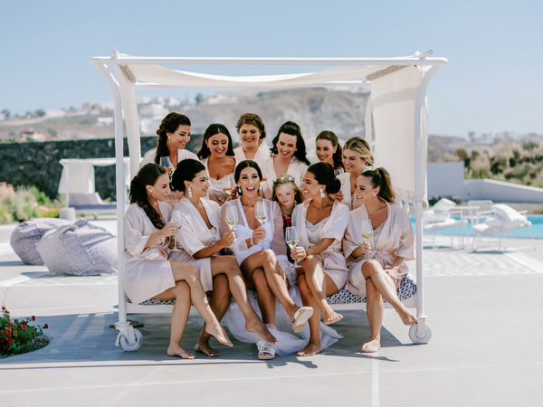 Luxury Santorini destination wedding bridal party.