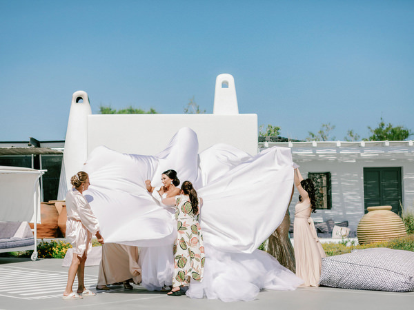 Bride revealing couture wedding gown at Eros Santorini.