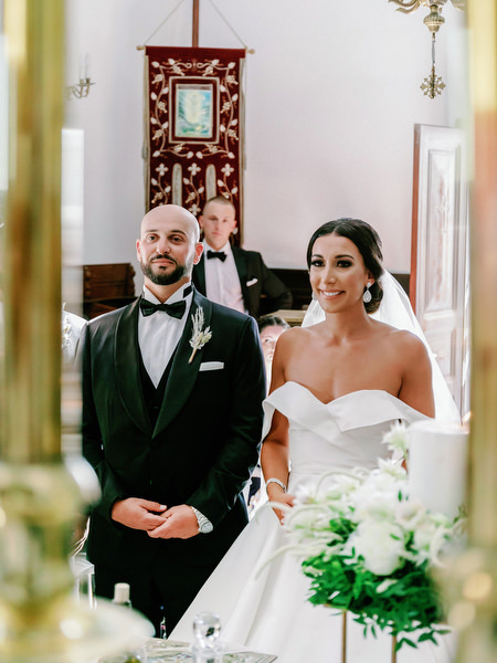Bride and groom inside Santorini church ceremony.