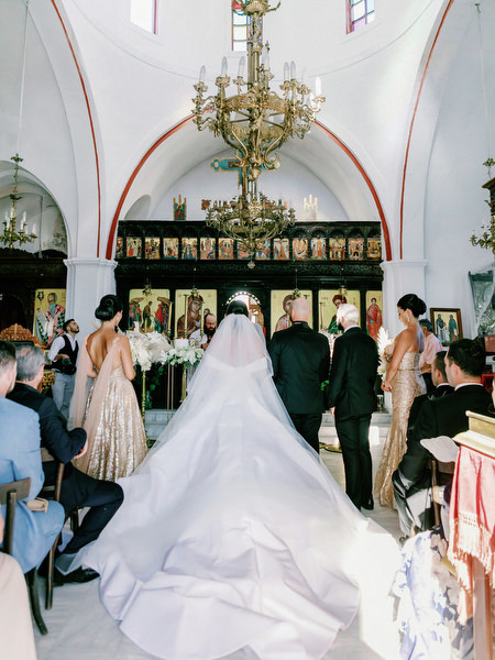 Bridal Gown back view inside Greek island church.
