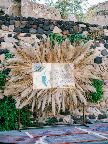 Arts Factory Santorini reception setup with pampas decor.