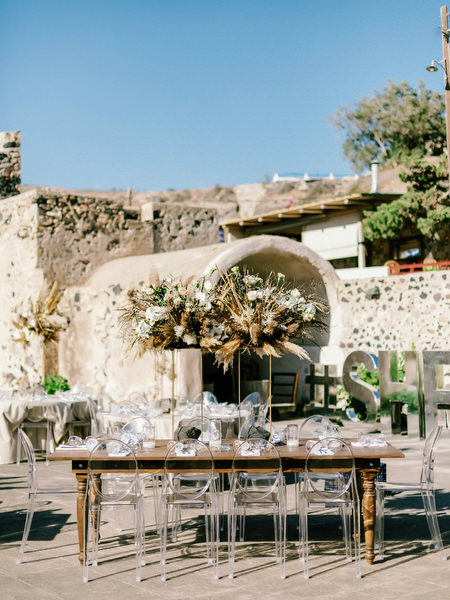 Arts Factory Santorini reception tables with pampas decor.