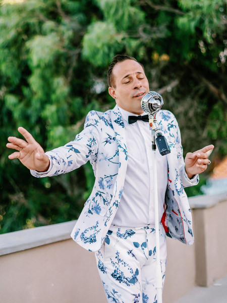 Live singer performing at Santorini wedding reception.