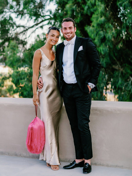 Stylish couple portrait at Santorini destination wedding.