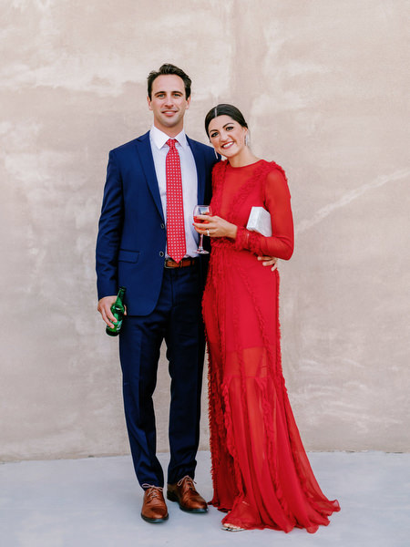 Guests in formal attire at Arts Factory Santorini.