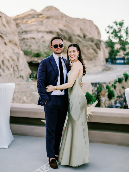 Couple portrait with volcanic cliffs Santorini.
