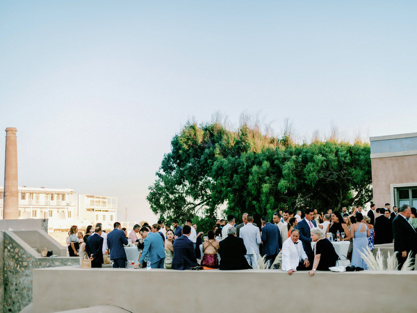 Guests gathered at Arts Factory Santorini reception terrace.