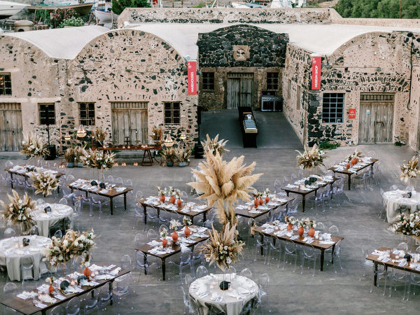 Arts Factory Santorini dinner setup with pampas decor.