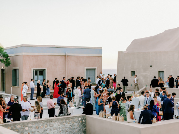 Guests mingling at Arts Factory Santorini wedding.