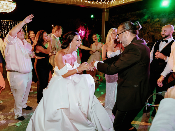 Bride dancing with guests at Arts Factory Santorini.