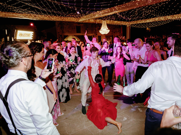 Guests dancing at Arts Factory Santorini wedding reception.