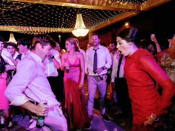 Bride twirling on Santorini wedding dance floor.