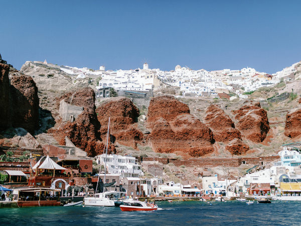Santorini harbor Ammoudi view with catamarans before wedding catamaran cruise