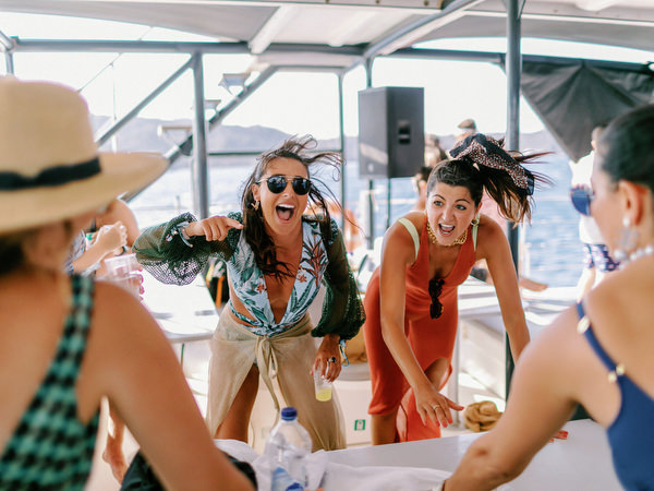 Guests dancing during Santorini wedding boat celebration