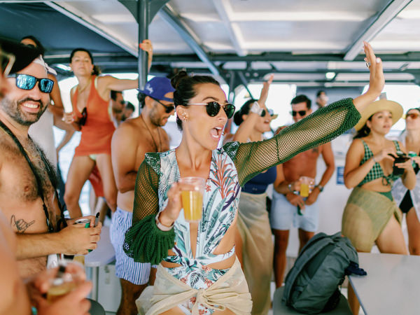 Wedding guests partying on Santorini sailing boat