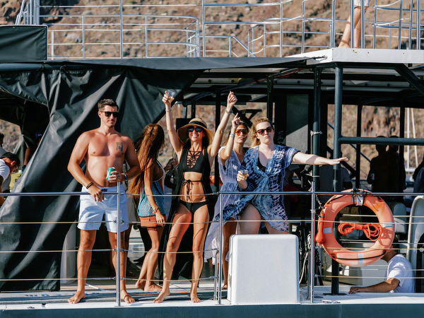 Guests dancing on deck during Santorini boat wedding party